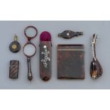 A collection of tortoiseshell and simulated items,
