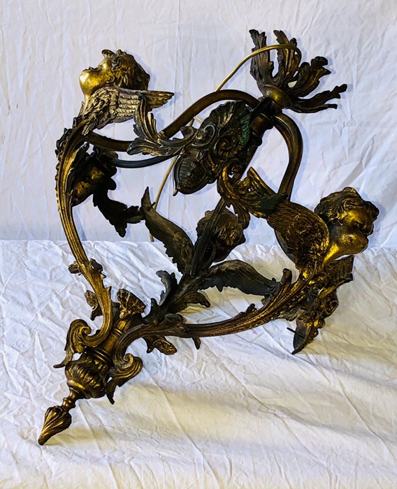 A late 19th Century gilt cherub hanging lighting.