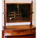 A George III mahogany bow front dressing mirror, circa 1820, in the manner of Thomas Sheraton, globe