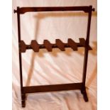 A late Victorian mahogany boot rack, turned side handles and pegs, width 72cm