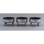 Three George III silver oval salts, pierced bright