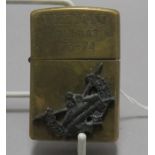 A Zippo lighter with inscription pertaining to the