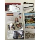 A collection of World stamps in two albums, first editions, coins, cards with pin badges too,