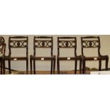 A set of four Regency period side chairs, rope twist crest rails, raised on sabre legs, all