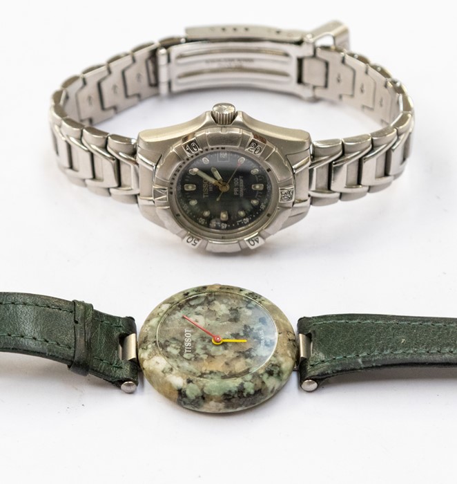 A ladies Tissot 'Rockwatch ' R150 wristwatch comprising a speckled green granite dial, red and