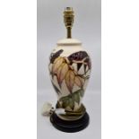 A Moorcroft Sumach Tree table lamp designed by Philip Gibson, date 2004, 40cm high including