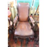 ***LOCATED AT GRESLEY****An early Victorian rosewood armchair with leather seat back and arms, on