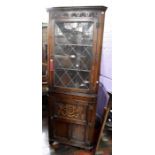 ***LOCATED AT GRESLEY**** Mid 20th Century carved oak corner cabinet with carved door detail, leaded