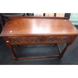 ***LOCATED AT GRESLEY**** A Jacobean style oak hall table, fitted with two short drawers, carved