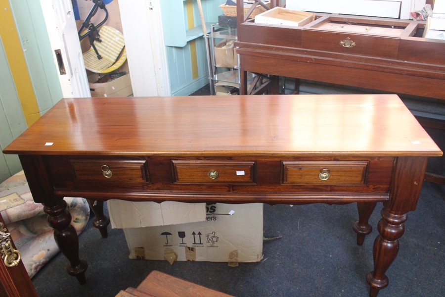 ***LOCATED AT GRESLEY**** Reproduction mahogany hall table with three side by side drawers on turned