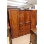 A Victorian mahogany triple sectioned wardrobe