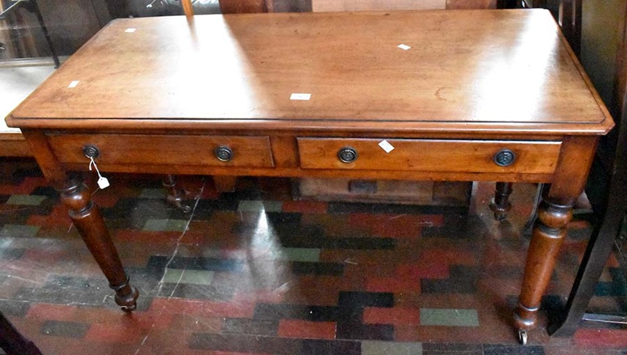 ***LOCATED AT GRESLEY**** A 19th Century mahogany two drawer writing desk, raised on turned legs,