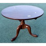 ***LOCATED AT GRESLEY****A George III mahogany tripod table, the top of circular form, 50cm high