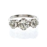 A diamond and platinum three stone ring, the centre stone approx 1.5cts, flanked by two smaller