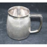 A Modern silver mug with rusticated body, plain border and handle, by C J Vander, London, 1971, 10.