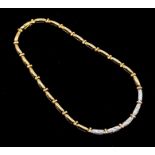 An 18ct gold and diamond set collar necklace, comprising elongated links of yellow gold to a central