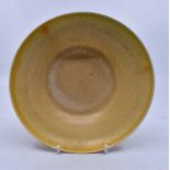 Ruskin Pottery: A Ruskin Pottery shallow bowl in yellow/orange glaze, diameter approx 15cm, height