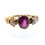 A Georgian tourmaline and pearl 18ct yellow gold ring, the central claw set pink tourmaline set