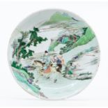 A Chinese famille verte dish, Qing dynasty, Kangxi period (1667-1722), painted to the interior