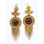 A pair of Victorian Etruscan revival earrings, each comprising a round cabochon garnet set to the