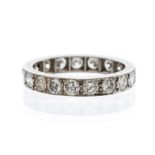 A diamond set platinum eternity ring, grain set with round brilliant cut diamonds, total diamond