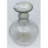 A French late 16th/early 17th Century rib soda glass moulded and part wrythen serving bottle,