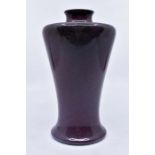 Ruskin Pottery: A Ruskin Pottery shouldered baluster vase in a high fired purple/blue mottled glaze,