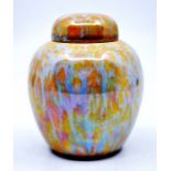 Ruskin Pottery: A Ruskin Pottery ginger jar and cover with yellow/orange and blue/grey speckled