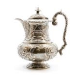A George III silver large coffee pot, baluster shaped and engraved with scrolling foliage and