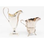 Two Georgian style silver cream jugs: a plain helmet shaped example on square base, by Purcell