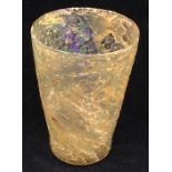 A rare Medieval glass beaker with wrythen body and rough pontil to base  Provenance: reputed to have