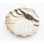 An Edwardian silver shell shaped butter dish on three ball feet, by Atkin Brother, Sheffield,
