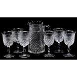 A set of six Thomas Webb wine glasses, hob nail cut on raised stems, stamped to bases together