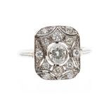 A diamond set platinum dress ring, Art Deco style rectangular pierced setting with round brilliant