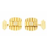 A pair of 18ct gold and diamond cufflinks, cushion shaped with ridged texture, applied square to the