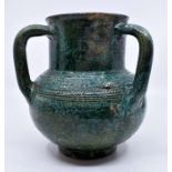 Islamic interest: A stoneware three handled tyg with a turquoise glaze and embossed decoration to