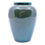 Ruskin Pottery: A Ruskin Pottery small baluster vase in high fired green glaze, height approx