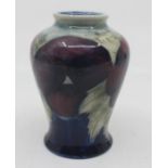 A Moorcroft small inverted baluster vase, Pansy pattern, impressed marks to base, M22, approx 9.