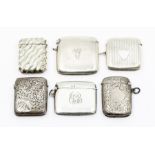 Five various early 20th Century silver vesta cases: two plain engraved with initials, , three with
