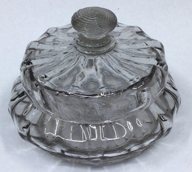 A late 17th/early 18th Century rib moulded pomade pot and cover with string glass foot rim, Low