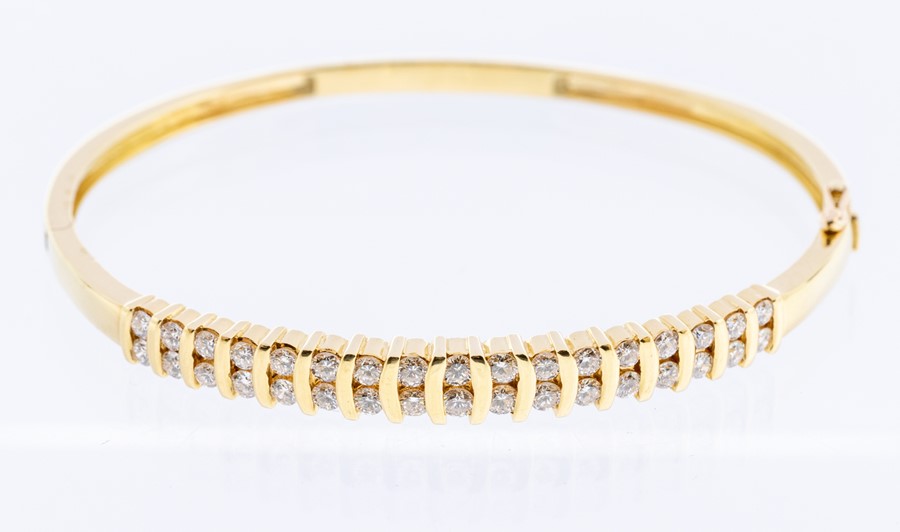 A diamond and 18ct gold double row bangle, comprising channel set brilliant cut diamonds, total - Image 5 of 6