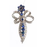 A sapphire and diamond platinum spray brooch, comprising diamond set ribbon decoration with claw set