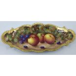 A Royal Worcester painted porcelain lozenge shaped dish, wavy gilt rim, the body painted with