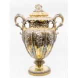 A George IV large silver gilt two handled cup and cover, the ovoid body with chased acanthus leaf
