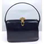 A collection of ladies handbags and purses to include, a blue leather Fassbender handbag with gold