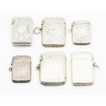 Five Victorian and a George V silver vesta cases, three plain and three with engraved decoration,