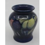 A Moorcroft small baluster vase, Wisteria pattern, impressed marks to base, number 146, approx 8.5cm
