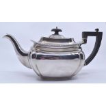 A Georgian style silver teapot, with gadroon rim, ebonised handle and pagoda finial, Birmingham,