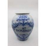 An 18th Century style earthenware blue and white drug jar, the ovoid body decorated with flowers and