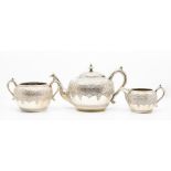 A Victorian Scottish silver three piece tea service comprising teapot, large sugar bowl and milk